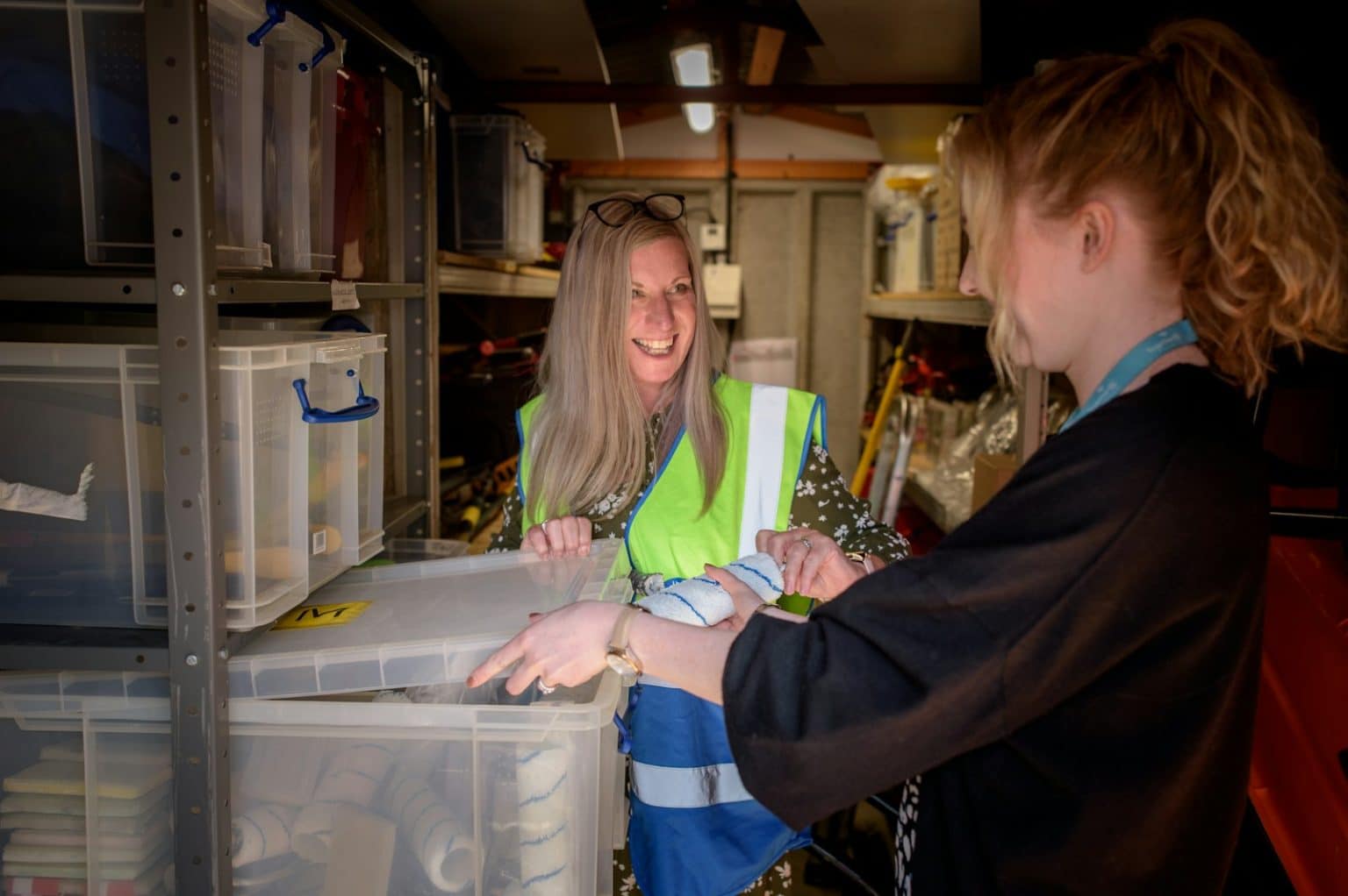 Wholesale team reviewing order documentation in a distribution warehouse
